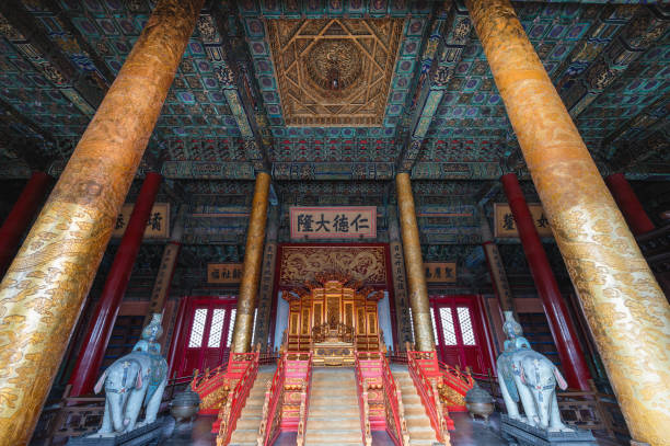 The majestic throne room of an ancient Chinese palace, showcasing traditional architecture, red pillars, and ornate decorations, symbolizing imperial power and Feng Shui principles.