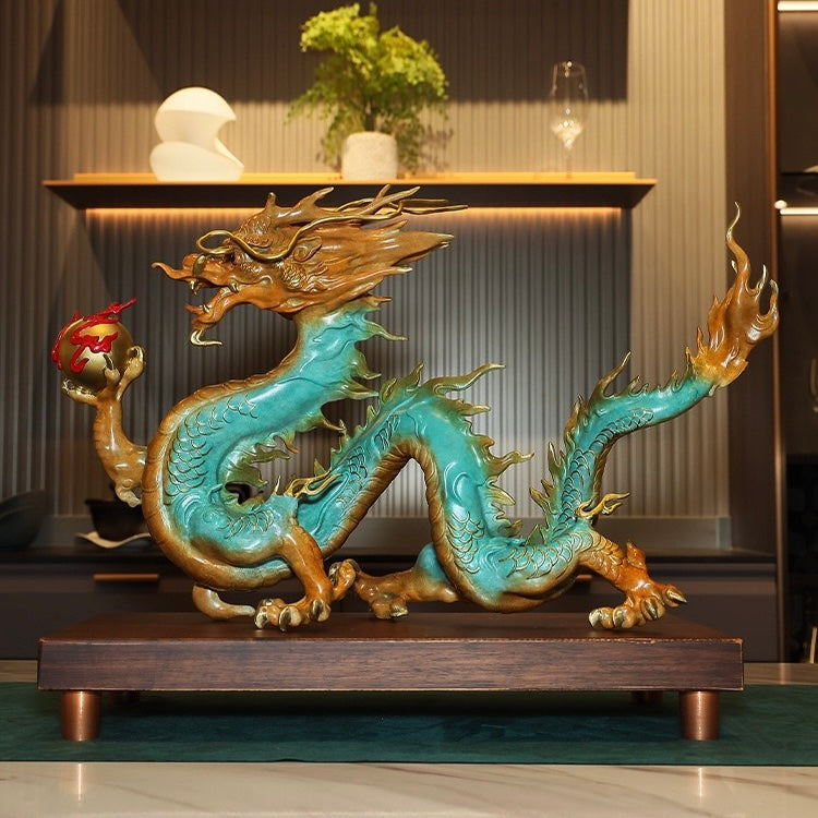 Front angle view of the Chinese dragon statue, holding a golden ball, symbolizing power and prosperity.