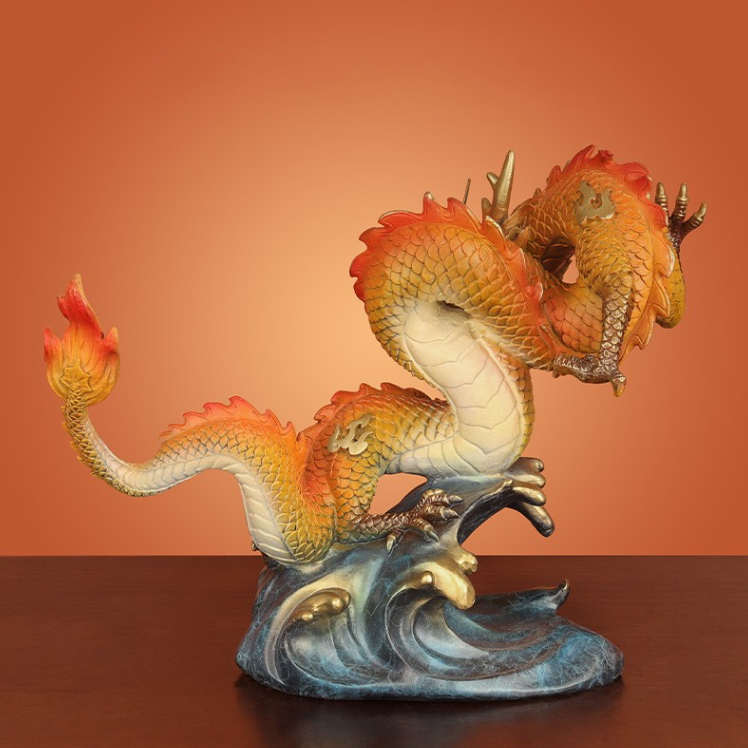 Back view of the golden Chinese dragon statue, showing the graceful curves and vibrant details of its design.