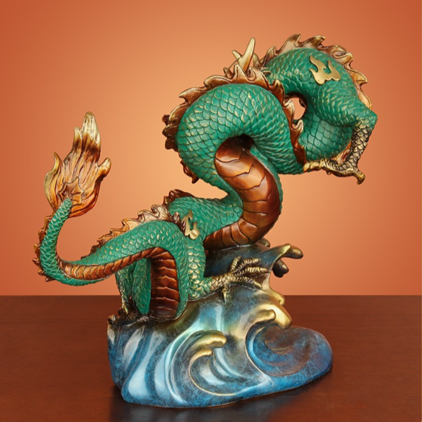 Back view of the green Chinese dragon statue, highlighting its intricate scales and flowing tail.
